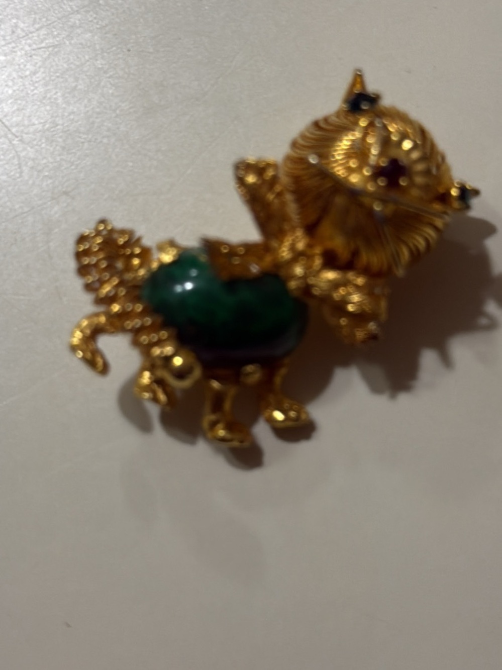 Vintage 1960 gold tone jelly belly cat pin, green glass cabochon belly